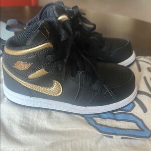 Nike Black and Gold Sneakers with Classic Design Jordan!
